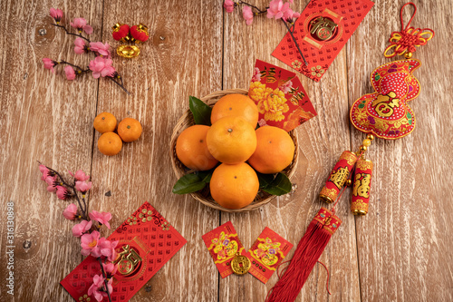 orange and red packet envelope on chinese new year celebration on wooden table