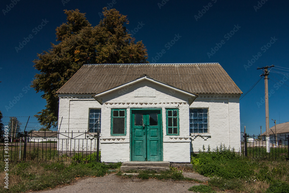 Rural house with green door in Parkhomivka, Kyiv oblast, Ukraine Rural house with green door in Parkhomivka, Kyiv oblast, Ukraine