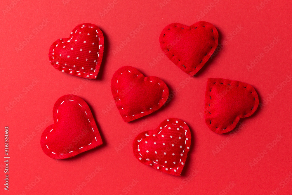Composition of textile red hearts on colorful background. Close up view. Top view of St. Valentine's day concept