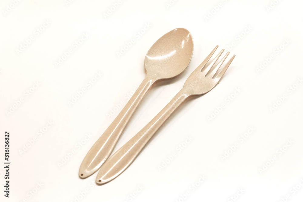 Zinc spoon and fork on a white background Zinc spoon and fork on a white background