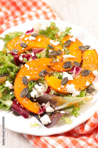 vegetable salad with roasted pumpkin slices, cheese and lettuce