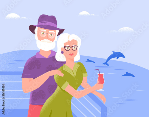 Two smiling senior spouses relax on the deck of a ship with refreshing drink, watching dolphins. Sea cruise.