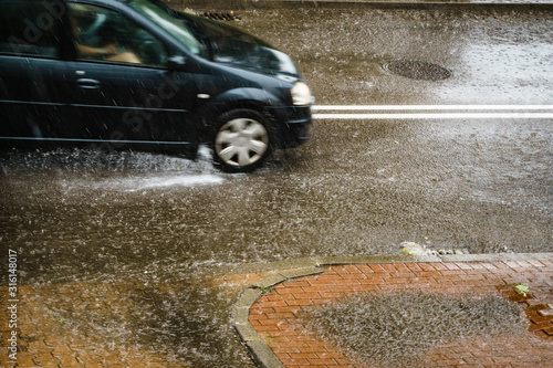 Rainy road with car