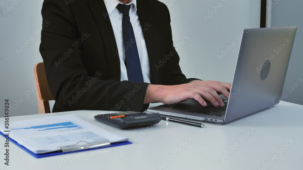 Business man working with Report chart and calculate budget in office planning new business project Business man working with Report chart and calculate budget in office planning new business project