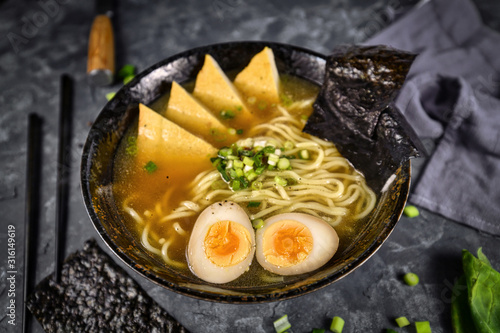Tableau sur toile Homemade vegetarian Japanese Ramen noudle soup with fried tofu slices, egg and s