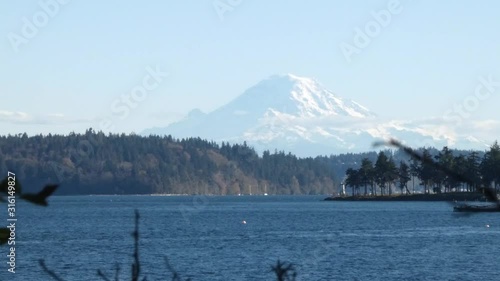 the puget sound in front of mount rainier on a sunny day photo
