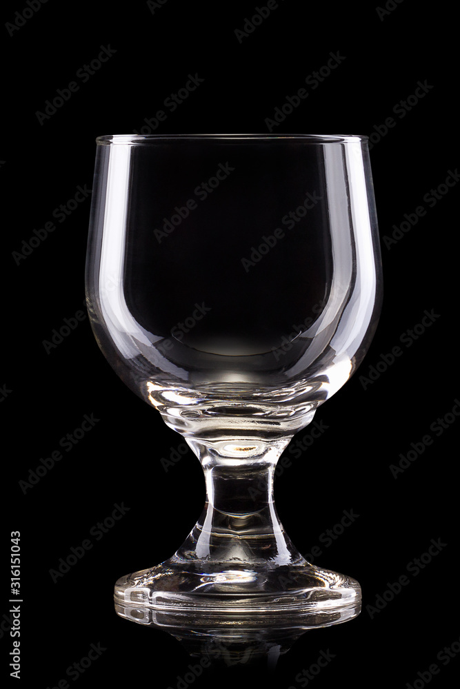 Empty beer glass or mug isolated on a black background with clipping path Empty beer glass or mug isolated on a black background with clipping path