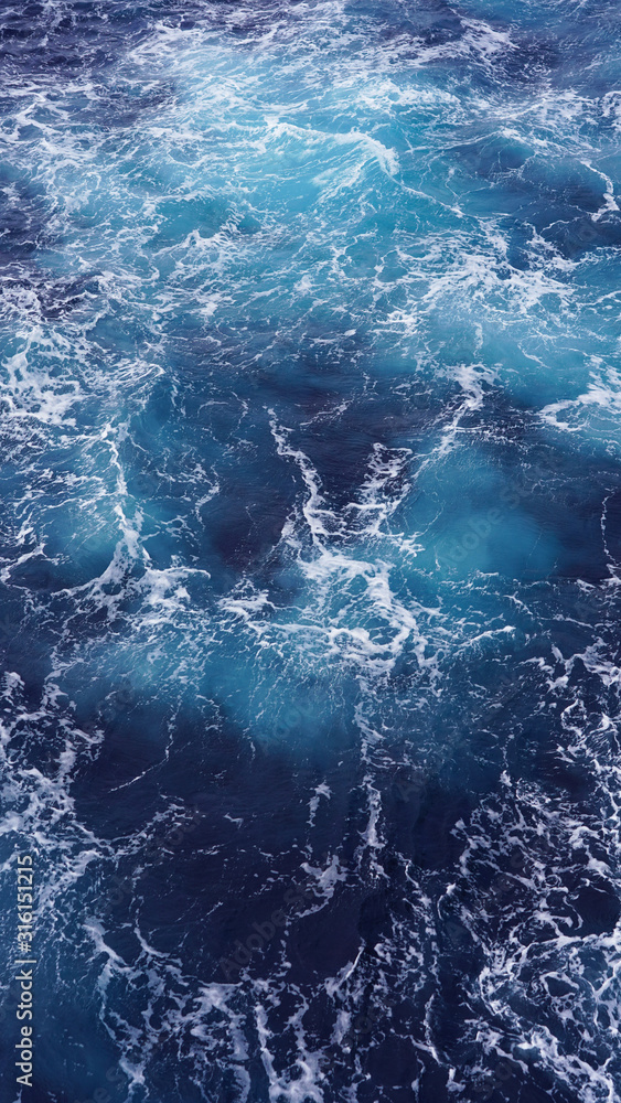 Dark water of the pacific ocean. Natural blue background. foam ...