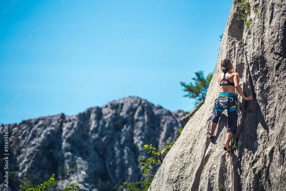 Woman engaged in extreme sport. Woman engaged in extreme sport.
