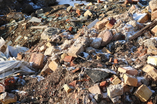 Construction waste with elements of various dismantled and destroyed old structures at municipal landfill