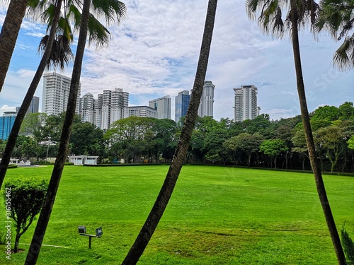 Canvas Print green park among the skyscrapers of kuala lumpur