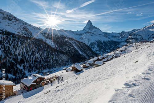 Findeln in Zermatt on beautiful winter day with Matterhorn and the sun photo