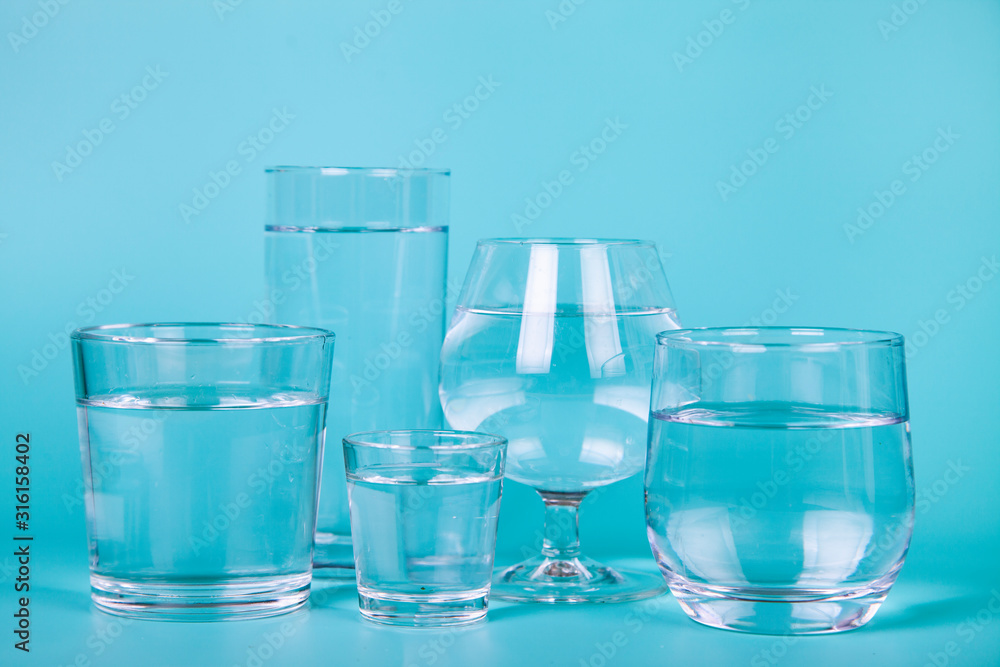 Glasses of different shapes with water Glasses of different shapes with water