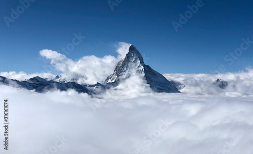 Zermatt Matterhorn and glacier view mountain winter snow landscape sea of fog clouds sunset