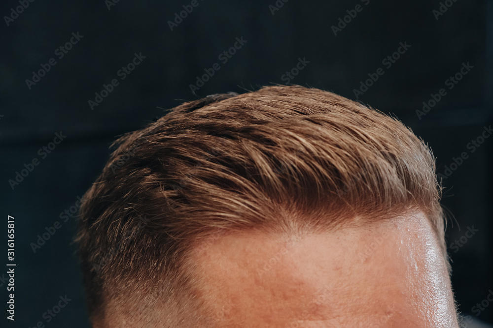 Close up photo of modern trendy men hairdress Close up photo of modern trendy men hairdress