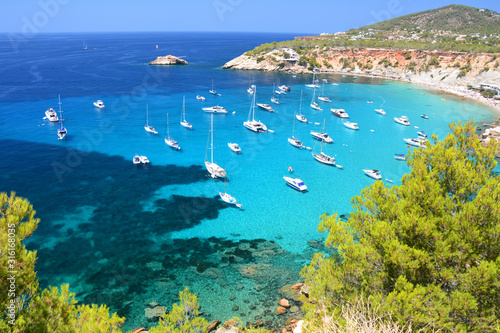 Cala d'Hort bay with beach and turquoise water on Ibiza photo