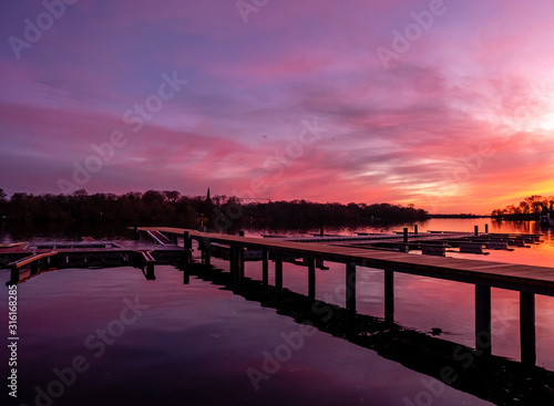 Reflection on a lake during colorful sunset, stock image, Potsdam, Germany © alexandernative