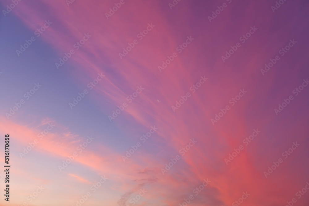 Orange magenta clouds in the sunset sky background
