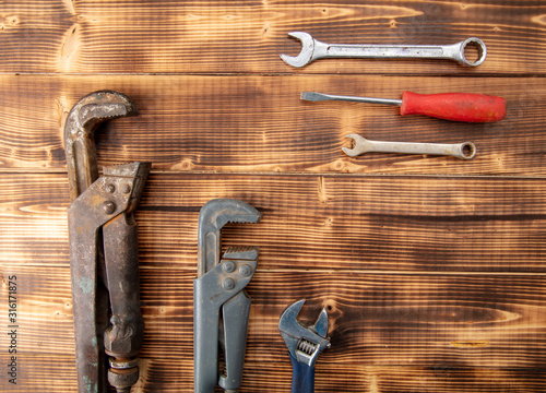 Adjustable wrenches, screwdriver and pliers