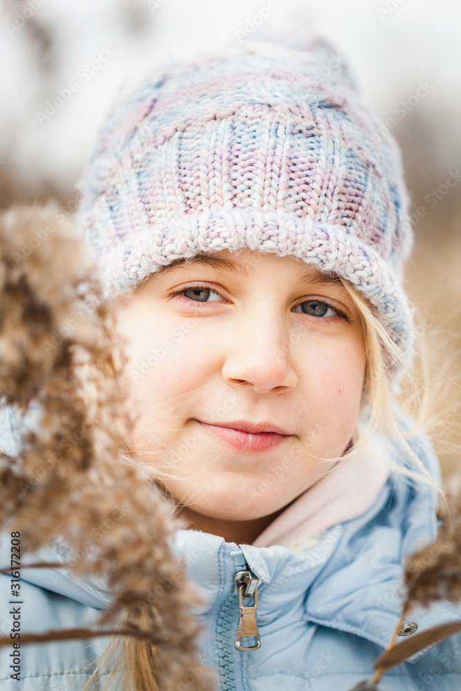 Girl on a walk in the forest, grass and snow, winter walks, forest, field, winter clothes Girl on a walk in the forest, grass and snow, winter walks, forest, field, winter clothes