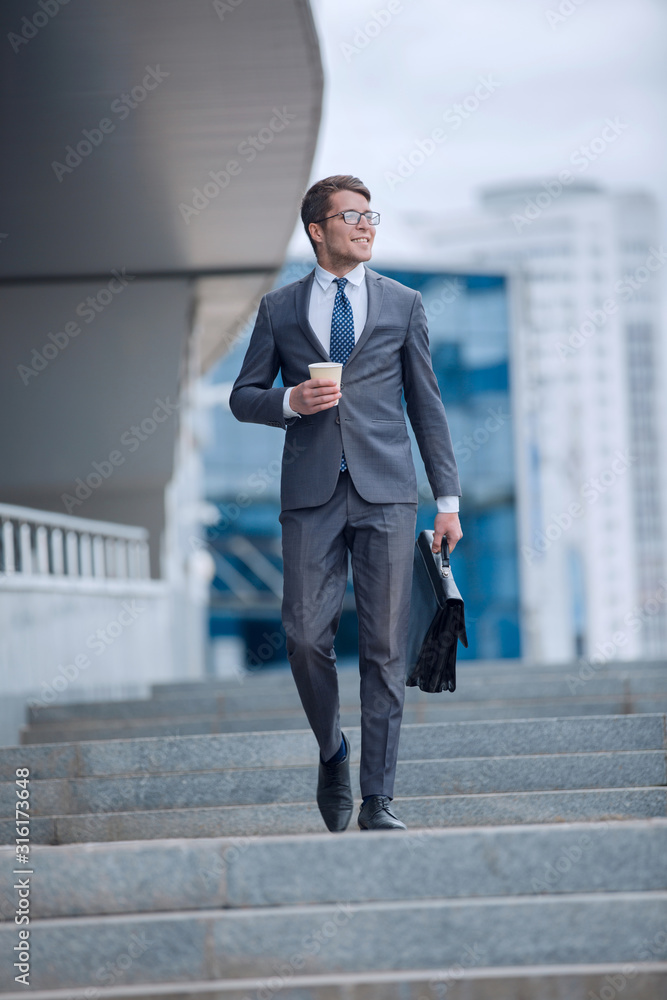 business man walking down the street of a big city business man walking down the street of a big city