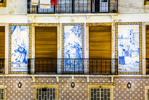 Traditional European architecture. Beautiful old house decorated with traditional antique tiles on the street in Lisbon in Portugal