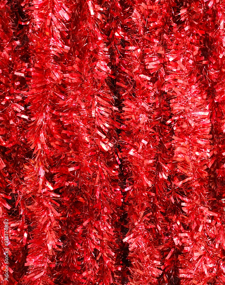 Red tinsel in the store as a background Red tinsel in the store as a background
