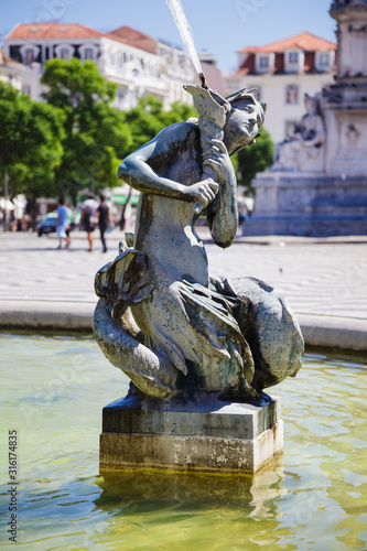 Fountain of the Praça do Rossio square in the center of Lisbon Portugal
