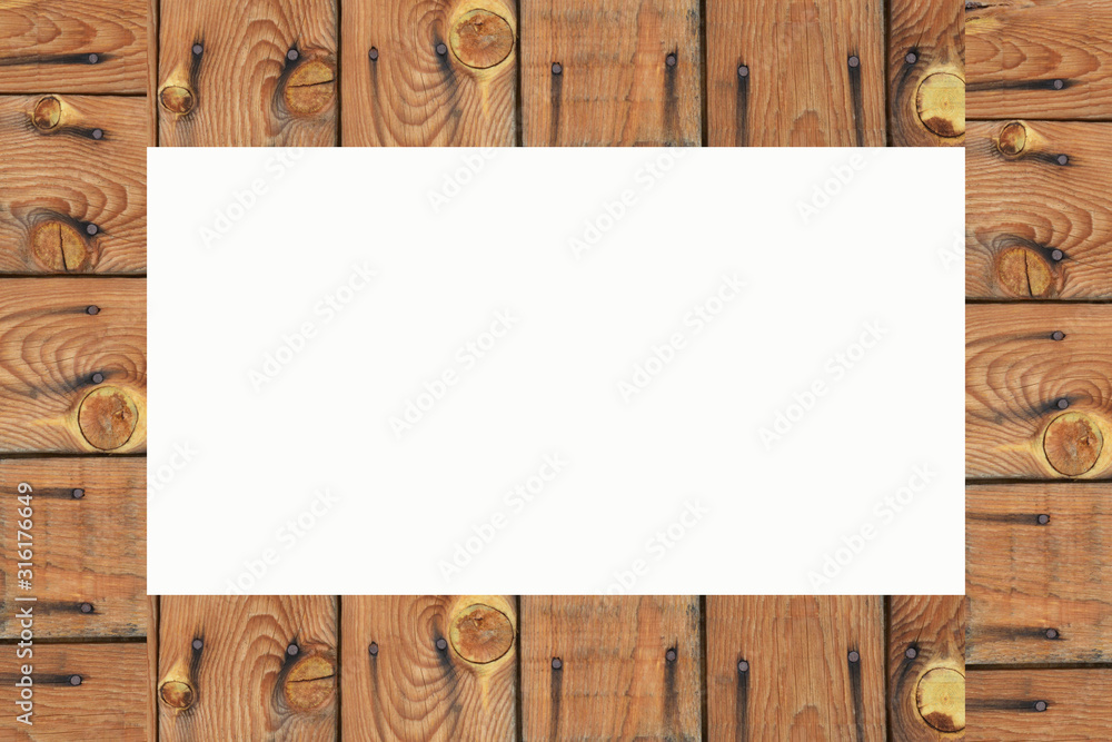 Naklejka premium empty frame on wooden wall background