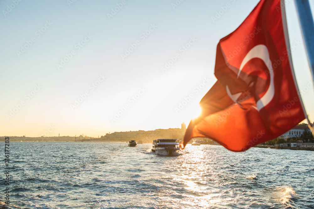 ISTANBUL TYRKEY - October, 2019. wake of a passenger ship with blue sky and clouds. view behind the speed boat. Boat back view on the black sea in the Istanbul, Turkey. - obrazy, fototapety, plakaty 