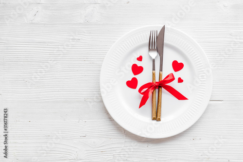 Valentines day table. Plate on grey background top-down copy space