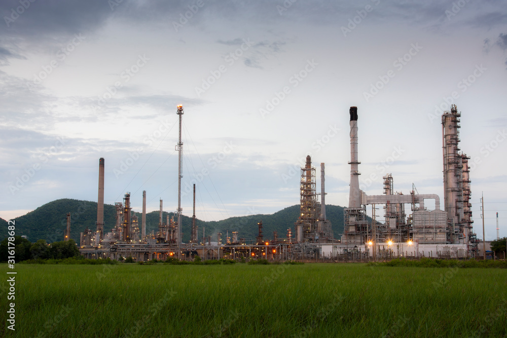 Oil refinery located in the green meadow