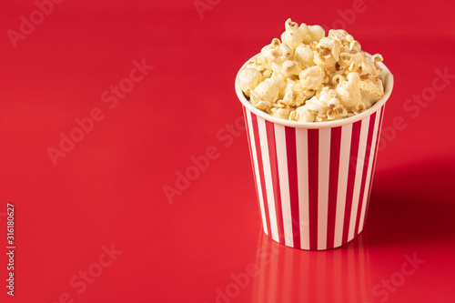 .popcorn blast cinema box with corn bucket on red isolated