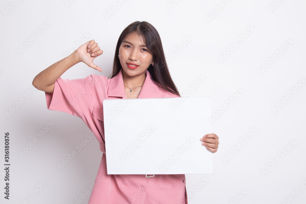 Young Asian woman show thumbs down with white blank sign. Young Asian woman show thumbs down with white blank sign.