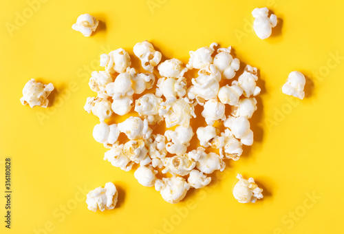 popcorn blast heart shape with corn on yellow isolated