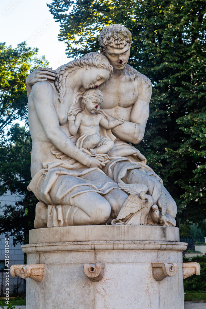 Statue of a mother a father and a child in a public garden in Lisbon, Portugal Statue of a mother a father and a child in a public garden in Lisbon, Portugal