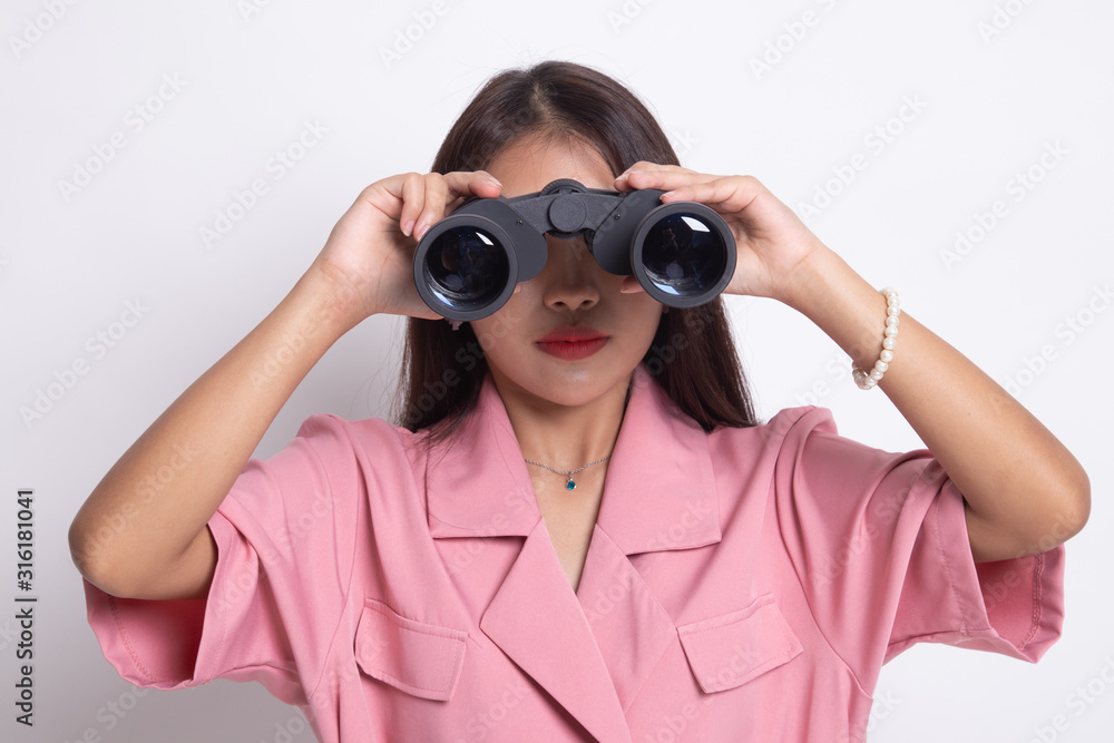 Young Asian woman with binoculars. Young Asian woman with binoculars.