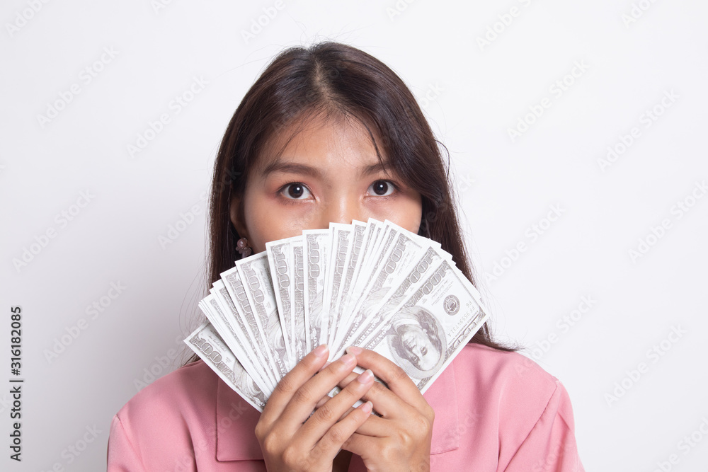 Portrait of young asian woman showing bunch of money banknotes. Portrait of young asian woman showing bunch of money banknotes.