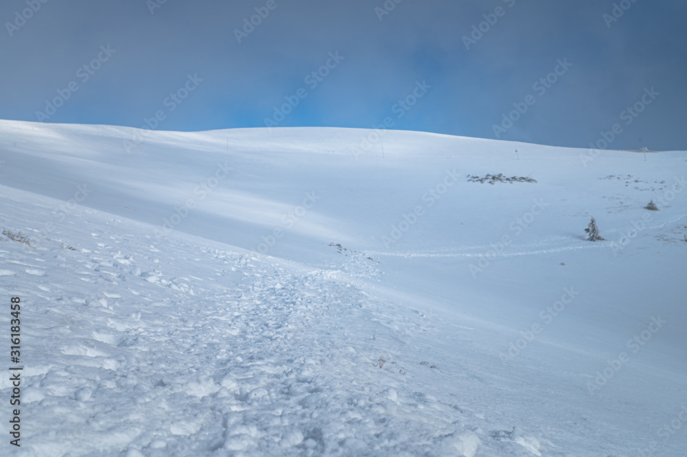 White winter hilly mountains. Edit space. High Quality Photo