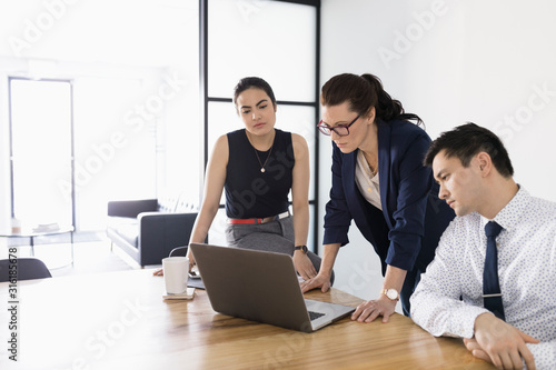 Foto Business people using computer in conference room meeting