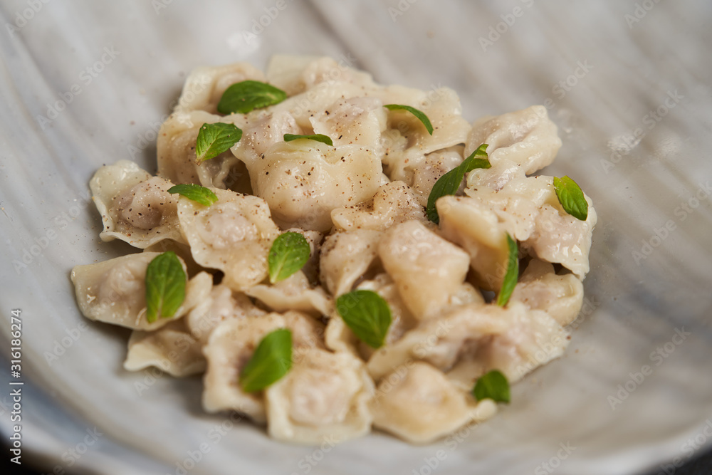 Traditional Azerbaijani cuisine, soup with small dumplings with a lot of spices Traditional Azerbaijani cuisine, soup with small dumplings with a lot of spices