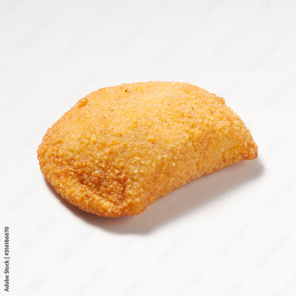Rissole, a small patty enclosed in pastry, or rolled in breadcrumbs, usually baked or deep fried, filled with savory ingredients. Isolated on a white background.