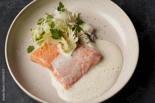 Trout fish sous vide with mashed cauliflower and mussel sauce