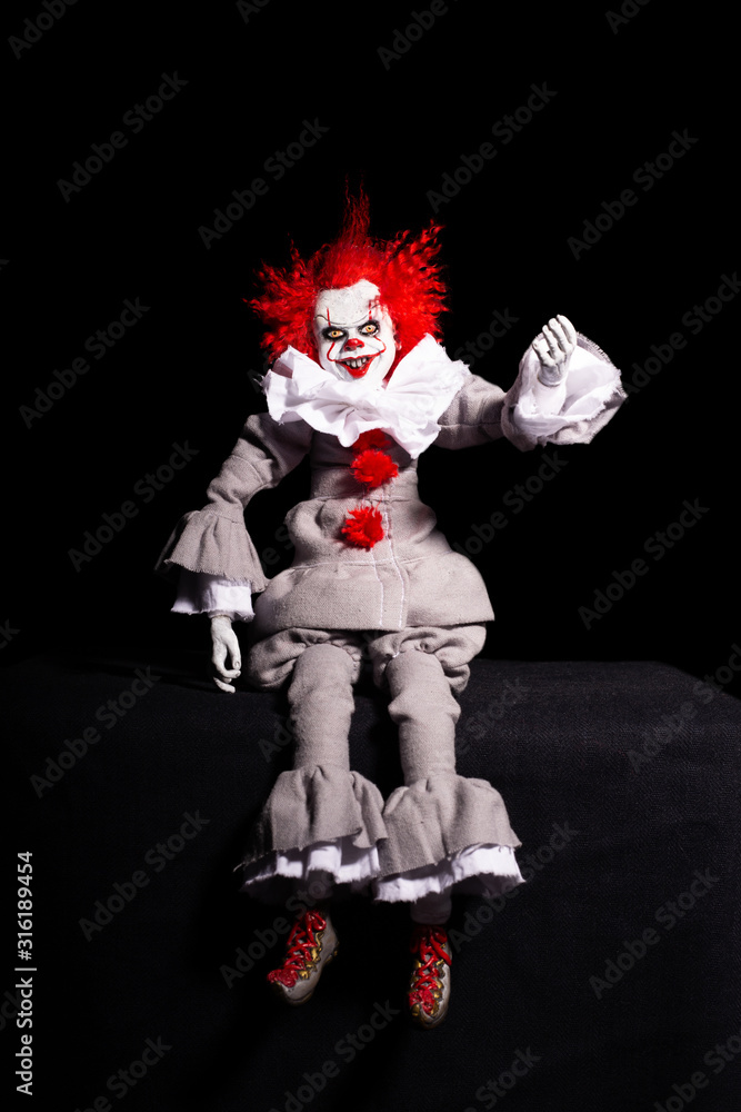 scary clown killer on a black background. horror. Halloween concept. creepy look. scary clown killer on a black background. horror. Halloween concept. creepy look.