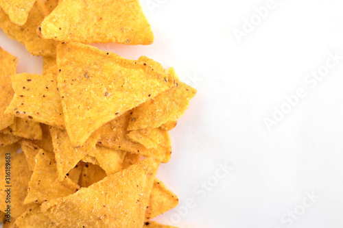 a pile of nachos on a white background