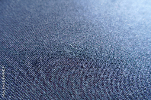 Macro of simple navy blue jersey fabric © Anna