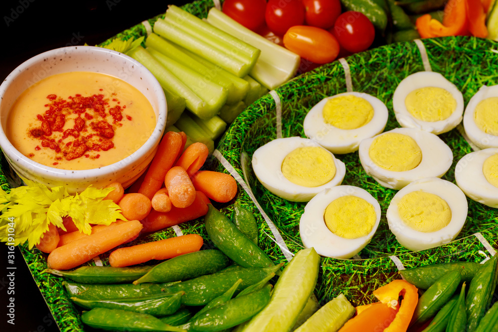 Boiled eggs with vegetable platter and dipping sauce, ranch. Boiled eggs with vegetable platter and dipping sauce, ranch.