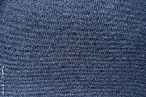 Surface of dark blue jersey fabric from above