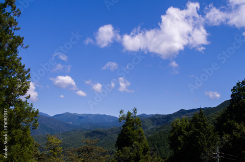 Landscape with trees in the blue sky, Ena Japan  © Ian