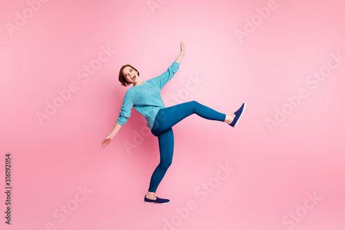 Full length body size view of her she nice attractive lovely carefree careless cheerful cheery girlish brown-haired girl walking having fun isolated over pink pastel color background